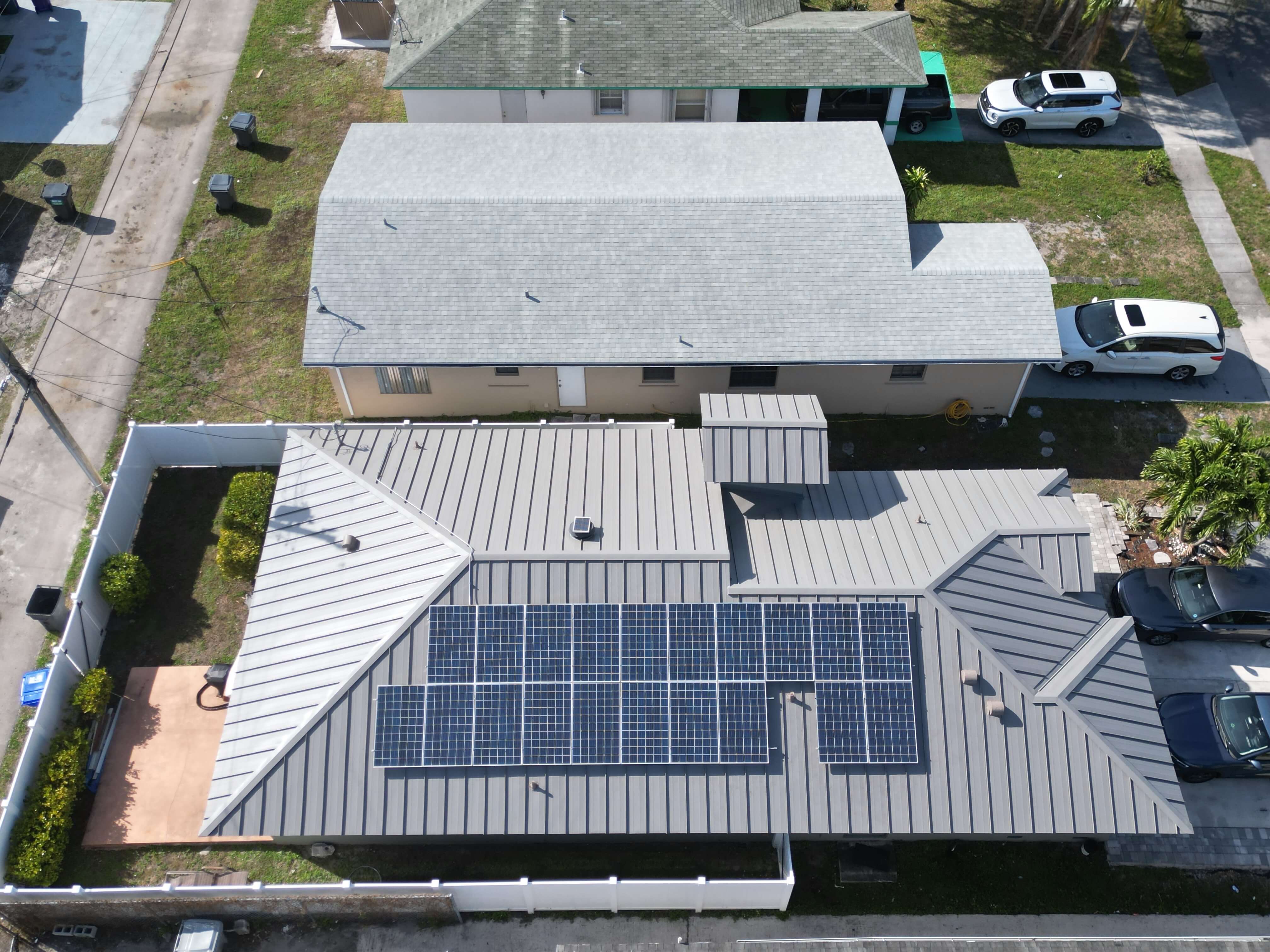 Finished metal roof and solar panels in plantation